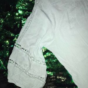 Light blue “FEVER” 2X top